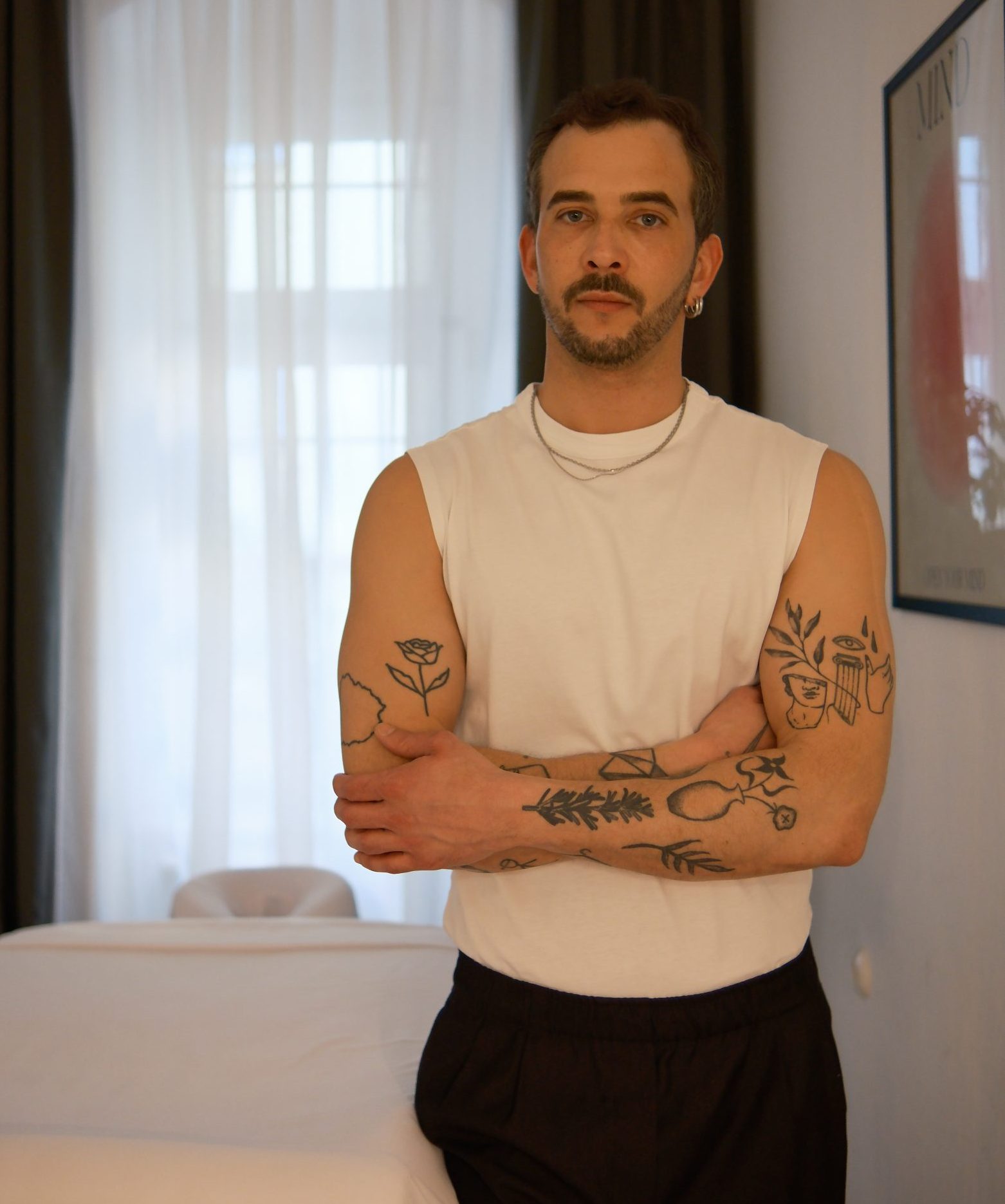 Camilo Standing in front of massage table in his studio in Berlin